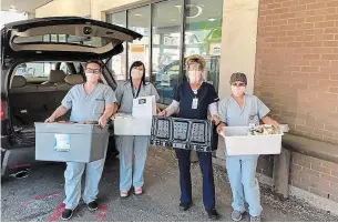  ?? SUBMITTED BY JAE SHIM ?? Emergency department staff at St. Joseph's Healthcare Hamilton pick up meals delivered by King's Landing Restobar on April 6.