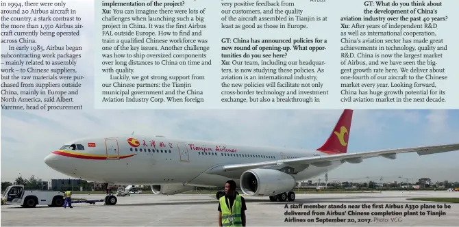  ??  ?? A staff member stands near the first Airbus A330 plane to be delivered from Airbus’ Chinese completion plant to Tianjin Airlines on September 20, 2017.