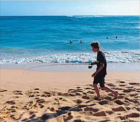  ?? DANIEL BEEKMAN THE SEATTLE TIMES/TNS ?? Warm waves and hot sand make Kiahuna Beach on Kauai’s South Shore a favourite for casual swimming.