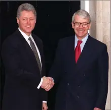  ??  ?? Former PM John Major greets ex-us president Bill Clinton