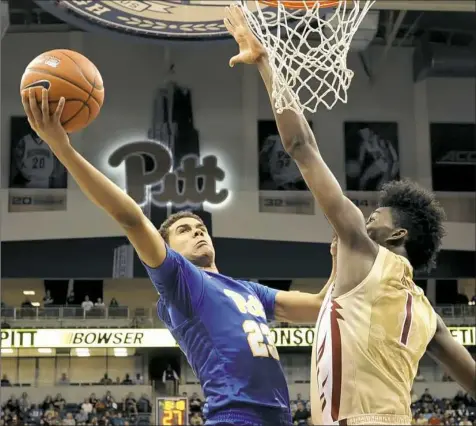  ?? Matt Freed/Post-Gazette ?? Guard Cameron Johnson goes up for a shot against Florida State's Jonathan Isaac Saturday at Petersen Events Center.