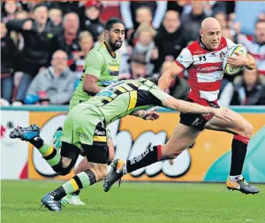  ??  ?? Power play: Willi Heinz runs past Northampto­n’s defence to score for Gloucester during their victory at the Kingsholm Stadium. It was a welcome result for Gloucester after last weekend’s loss to Sale Sharks