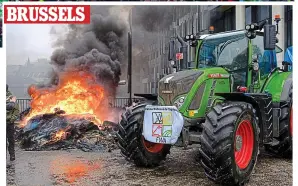  ?? ?? BRUSSELS
Chaos: Farmers burn tyres at protest in the heart of the EU district