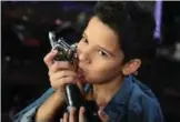  ??  ?? Moroccan Hamza Labyad, the winner of season two of the ‘The Voice Kids: Ahla Sawt’, poses for a picture with his trophy.