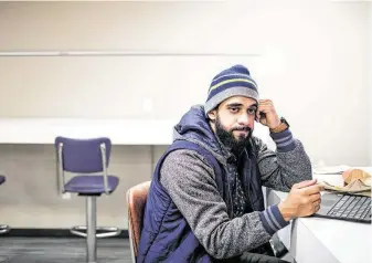  ?? Jon Shapley / Staff photograph­er ?? “Whenever the court reads some of the things I said, I think to myself, ‘How could I have been so closed-minded?’ ” said Asher Khan, a would-be ISIS recruit, as he studied for final exams at UH.