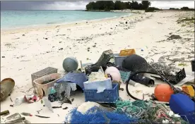  ?? ASSOCIATED PRESS FILE PHOTO ?? Plastic and other debris is seen on the beach on Midway Atoll in the Northweste­rn Hawaiian Islands.