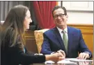  ?? Jessica Hill / Associated Press ?? Gov. Dannel P. Malloy works on his final closing speech at the end of session with Communicat­ions Director Kelly Donnelly in his office at the state Capitol on Wednesday in Hartford.