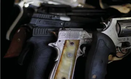  ??  ?? Seized guns about to be destroyed in a foundry in Quezaltepe­que, El Salvador, October 31, 2019.Photograph: José Cabezas/Reuters