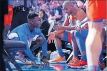  ?? [BRYAN TERRY/THE OKLAHOMAN] ?? Oklahoma City's Chris Paul, right, and Dennis Schroder talk during a timeout at a recent game in Chesapeake Energy Arena.