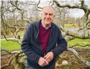  ?? Brian A. Pounds/Hearst Connecticu­t Media ?? Warren Jacques, who recently retired after 50 years as Trumbull tree warden, is pictured with what he considers the town's greatest tree, a 125-year-old dissectum laceleaf Japanese maple, at Twin Brooks Park in Trumbull. Jacques moved the tree to the park from the Abriola Funeral Home property in the 1990s.