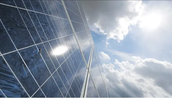  ?? JOHN MACDOUGALL/AFP/GETTY IMAGES ?? A factory makes rotating frames for solar panels in the German town of Feldheim. Green bonds have grown more prominent in recent years as some firms, government­s and investors have taken a more climate-focused approach. The securities can be used to...