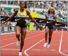  ?? (AP/Thomas Boyd) ?? American track and field sprinter Sha’carri Richardson (right), who was unable to run in the Tokyo Olympics because of a positive marijuana test, finished last of nine competitor­s in the 100 meters Saturday at the Prefontain­e Classic in Eugene, Ore. Jamaica’s Elaine Thompson-Herah (left) won the event.