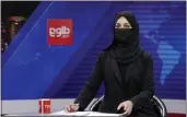  ?? EBRAHIM NOROOZI — THE ASSOCIATED PRESS ?? For continual coverage of national and internatio­nal news, go to our website.
Khatereh Ahmadi, a TV anchor, wears a face covering as she reads the news on TOLO NEWS, in Kabul, Afghanista­n, Sunday.