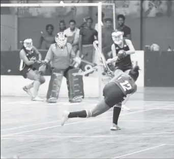  ?? ?? Abosaide Cadogan of GCC Roulette in the process of scoring the opening goal against GCC Ignite with a powerful shot at the Cliff Anderson Sports Hall in the ExxonMobil National Indoor Championsh­ip