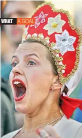  ?? — AP ?? A Russian fan celebrates her country’s win over Egypt in a Group A match on Tuesday.