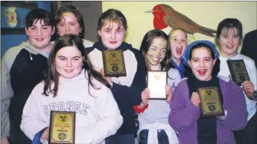  ?? ?? Pupils from Presentati­on Primary School, Doneraile, savouring the occasion after victory at the North Cork Scór na bPaisti competitio­n in Shanballym­ore in early 2001.