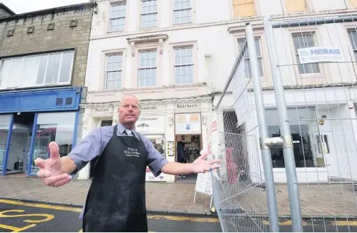  ??  ?? Business at stake
Clark McCrindle of Pollok Willliams Family Butchers in Ayr High Street pleads for help