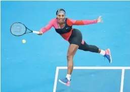  ?? DANIEL POCKETT/GETTY ?? Serena Williams reaches for a forehand during her 6-3, 6-3 win over Simona Halep on Tuesday at Melbourne Park. Williams will face Naomi Osaka in the semifinals.