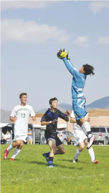  ??  ?? Moriarty’s goalkeeper Isaac Dominguez reaching high to stop an East Mountain attack, Sept. 7. Photo by Ger Demarest.