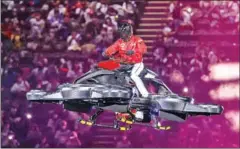  ?? STR/AFP ?? Tsuyoshi Shinjo entering the stadium on a hover-bike.