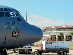  ?? NZ DEFENCE FORCE via AP ?? A New Zealand Defence Force Hercules aircraft arrives at Tonga’s Fua’amotu Internatio­nal Airport, near Nuku’alofa on Thursday to deliver aid.