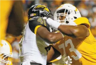  ?? STAFF FILE PHOTO BY C.B. SCHMELTER ?? Tennessee offensive lineman Trey Smith blocks Southern Mississipp­i linebacker Racheem Boothe during their game last November in Knoxville.