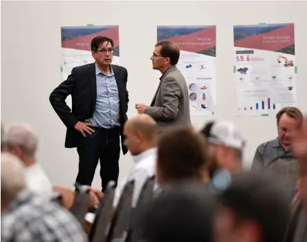  ?? CITIZEN PHOTO BY BRENT BRAATEN ?? West Coast Olefins president Ken James and COO Ron Just talk prior to an open house held on Wednesday to discuss a proposed $5.6 billion petrochemi­cal facility in Prince George.