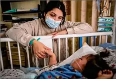  ?? Francine Orr / TNS ?? Priscilla Velazco keeps a watchful eye on her 16-month-old daughter, Emilia Zarazua, at a California hospital on Dec. 28. Emilia fell ill with respirator­y syncytial virus, or RSV.