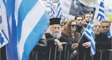  ?? Picture: Reuters ?? Protesters wave Greek flags and shout slogans yesterday during an Athens rally against using the name Macedonia in any solution to a dispute between Athens and Skopje over the former Yugoslav republic’s name.