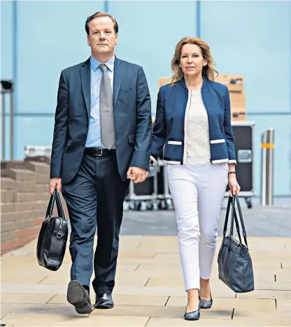  ??  ?? Charlie Elphicke, the former MP for Dover, with his wife Natalie, the current MP for Dover, arriving at Southwark Crown Court, London, where he denies three counts of sexual assault relating to two women