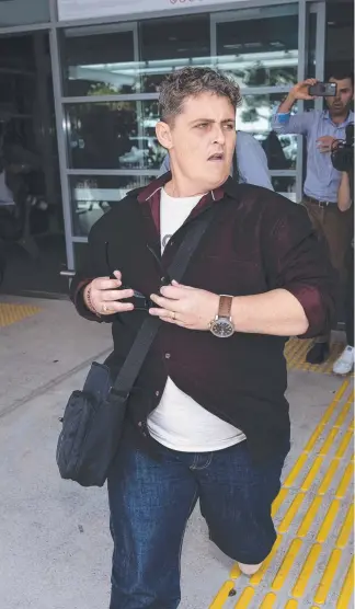  ?? Picture: BROOK MITCHELL/GETTY IMAGES ?? Renae Lawrence charges through a media pack at Newcastle Airport yesterday after being freed from a Bali jail.