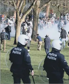  ?? Picture: AFP/Getty ?? AGGRO Police clash with people in a Brussels park last week.