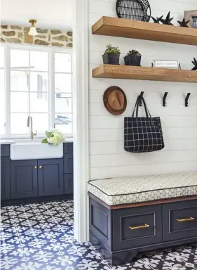  ??  ?? (above, right) Sometimes life gets messy, and Southern Studio gets that. This adorable mudroom provides extra storage and a comfy spot for guests to sit down while slipping out of their shoes. “Enjoy the process and embrace the messiness,” they say.