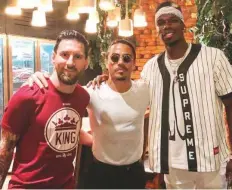  ?? Dubai Media Office twitter ?? Lionel Messi and Paul Pogba at Salt Bae’s Nusr-Et Turkish steak house at the Four Seasons Resort in Jumeirah.