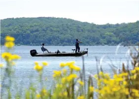  ?? STAFF PHOTO BY TIM BARBER ?? Boaters fish on Chickamaug­a Lake on Friday.