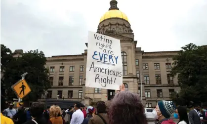  ?? Photograph: Robin Rayne/Zuma Wire/Rex/Shuttersto­ck ?? People outside the Georgia statehouse in 2021 protested restrictiv­e voting laws; now state Republican­s are proposing even more.
