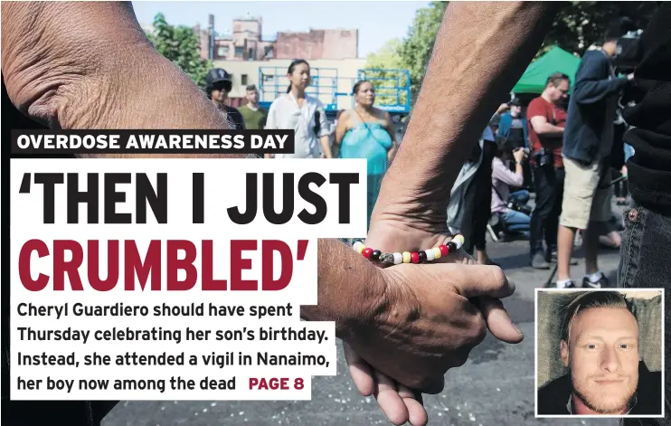  ?? — THE CANADIAN PRESS ?? Two men hold hands as people form a circle during a memorial service to remember those who have died in B.C. as a result of the drug-overdose crisis, on Internatio­nal Overdose Awareness Day in Vancouver’s Downtown Eastside Thursday. Inset, Brett Colton...