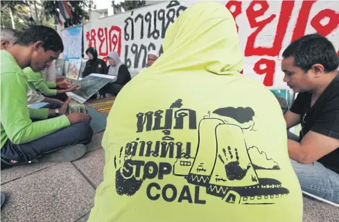  ?? THITI WANNAMONTH­A ?? Protesters against a coal-fired power plant in Songkhla’s Thepa district gather in Bangkok in February calling for the terminatio­n of the project. The government has suspended the project pending further study.