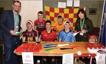  ??  ?? Schools Enterprise Programme co-ordinator Gary Lowe and Joan Kelleher of LEO Mallow and students from the Patrician Academy, Mallow ‘Hurley Holders’ company.