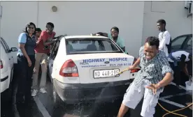  ??  ?? GOOD FUN: A group of students attended the 2015 Mandela Day at the Highway Hospice to help by washing patients’ and staff cars.