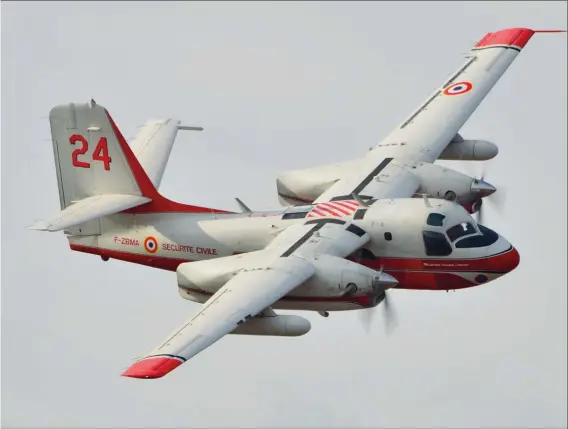  ?? F. MARSALY ?? Comme l’arrière de ses fuseaux moteurs l’indique, le T24 est un ancien avion américain, un US-2B en l’occurrence.