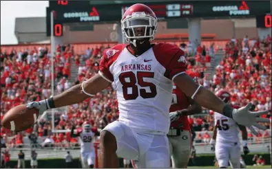  ?? (Democrat-Gazette file photo) ?? Arkansas wide receiver Greg Childs celebrates after scoring the winning touchdown in the final seconds on a pass from Ryan Mallett in the Razorbacks’ victory at Georgia in 2010. Georgia leads its series with Arkansas 10-4 entering Saturday’s game at Fayettevil­le.