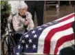  ?? J. SCOTT APPLEWHITE — ASSOCIATED PRESS ?? Roberta McCain, the 106-year-old mother of Sen. John McCain, sits near her late son's flag-draped casket in the rotunda of the U.S. Capitol on Friday.