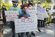  ?? Luis Sinco Los Angeles Times ?? STUDENTS and parents were among those attending a rally announcing a lawsuit against the LAUSD.