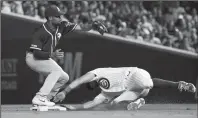  ?? ARMANDO L. SANCHEZ/TRIBUNE NEWS SERVICE ?? Athletics shortstop Marcus Semien, left, tags out Cubs left fielder Kyle Schwarber on Monday in Chicago.