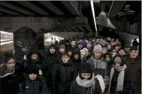  ?? FELIPE DANA — THE ASSOCIATED PRESS ?? Ukrainians crowd under a destroyed bridge as they try to flee crossing the Irpin river on the outskirts of Kyiv, Ukraine, Tuesday, March 8, 2022.