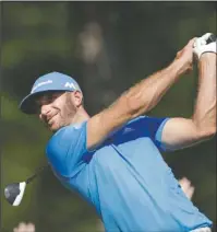  ?? The Associated Press ?? LEADER OF THE PACK: Dustin Johnson hits from the tee on the 12th hole en route to a 3-under 67 and a one-stroke lead over Kevin Chappell midway through the Tour Championsh­ip at East Lake Golf Club in Atlanta.