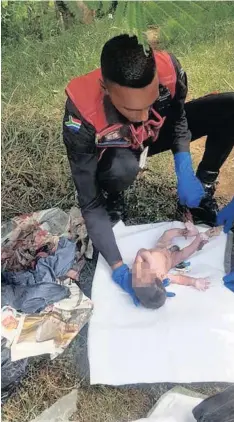  ?? PICTURES: SUPPLIED ?? A REACTION officer attending to the baby boy at the scene on Monday afternoon. On the left is the bloodied newspaper and bin bag the baby was found in.