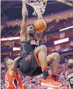  ?? DAVID J. PHILLIP/ ASSOCIATED PRESS ?? Houston’s Clint Capela dunks for two of his careerhigh 28 points in the Rockets’ win over New Orleans Monday night.