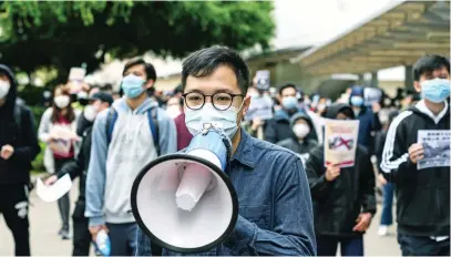  ?? Picture: AFP ?? HANDS OFF. Residents in Mei Foo district in Hong Kong protest yesterday against government plans to convert a local heritage site into a quarantine camp amid the outbreak of the coronaviru­s which began in the central Chinese city of Wuhan.